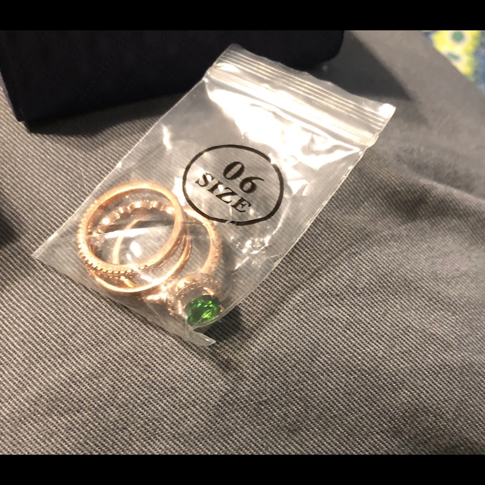 BNIB three-ring set in gold and green.